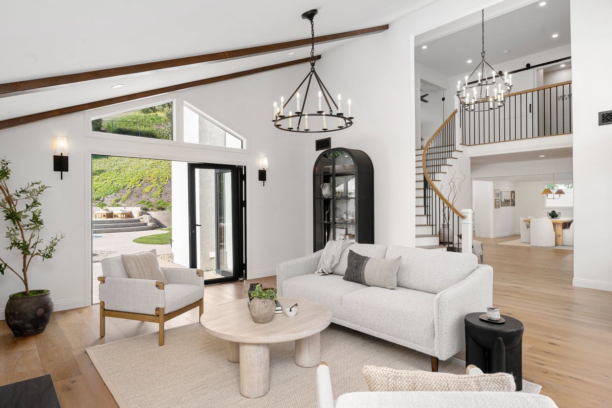 A modern living room with white furniture