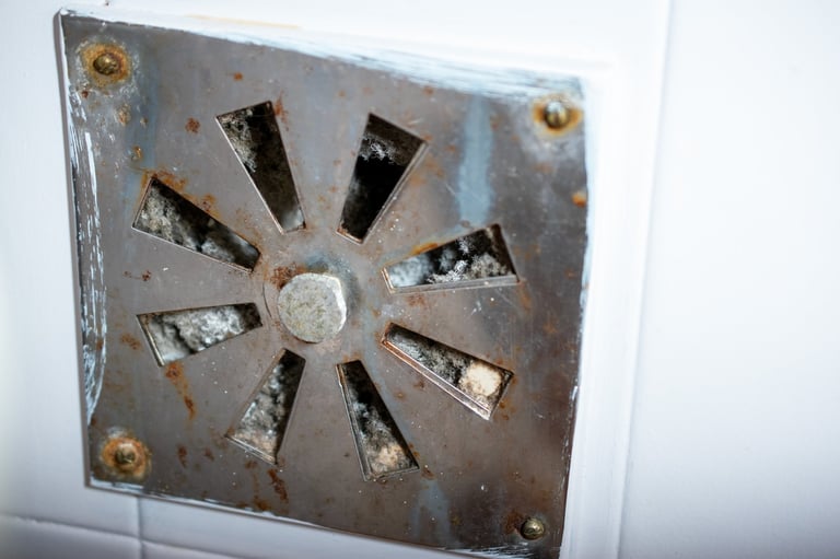 Close-up of a Rusty and Dirty Metal Vent with Debris