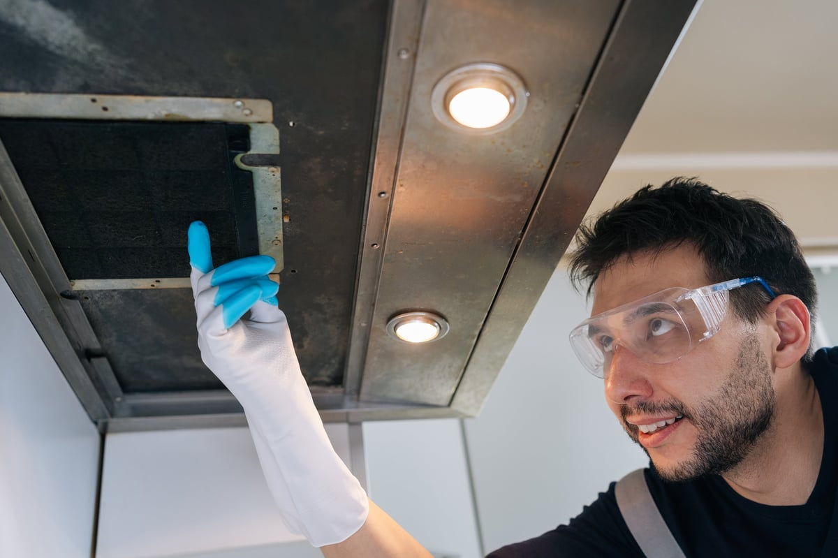 Professional worker with safety glasses performing inspection