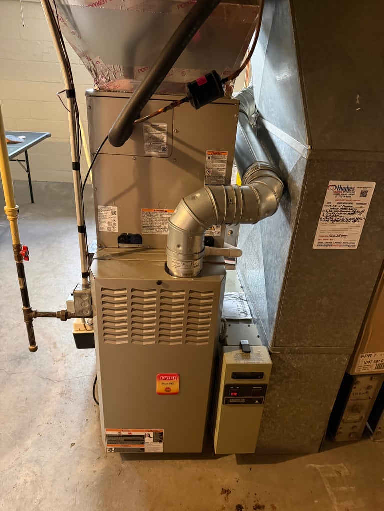 Residential furnace unit with metal ductwork and control panel mounted in basement
